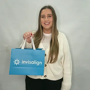 A patient collecting their Invisalign aligners