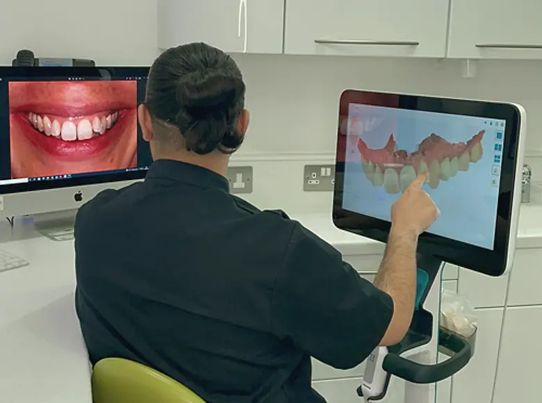 A clinician reviewing a 3D dental scan at Park Place Dental